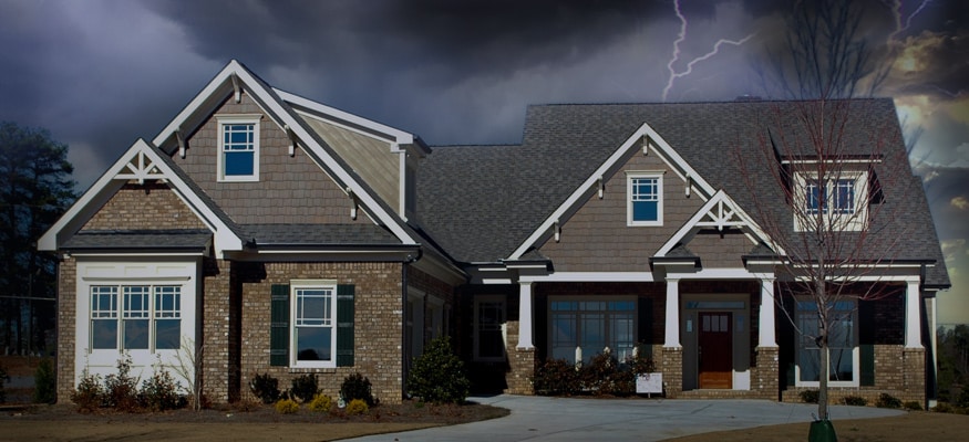 Home with dark clouds and lightning